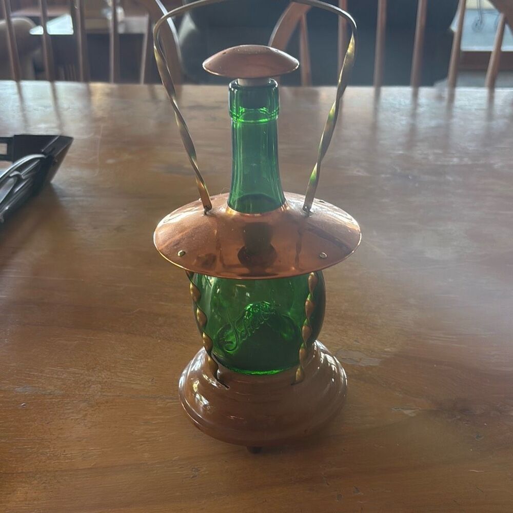 vintage green glass bottle and copper lantern music box
